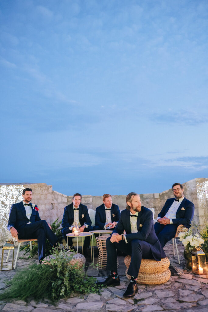 A scenic view of Hvar’s rugged coastline with turquoise waters and sailboats dotting the horizon — the perfect destination wedding backdrop.