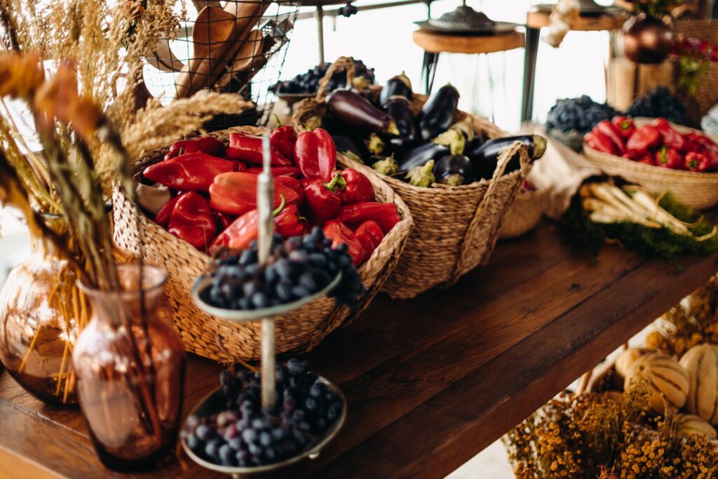 Retro event setup featuring red checkered tablecloths, dim lighting, and vintage decor.