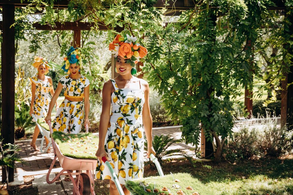 Stunning outdoor event venue by the Adriatic Sea, surrounded by lush greenery and lemon-themed decorations.