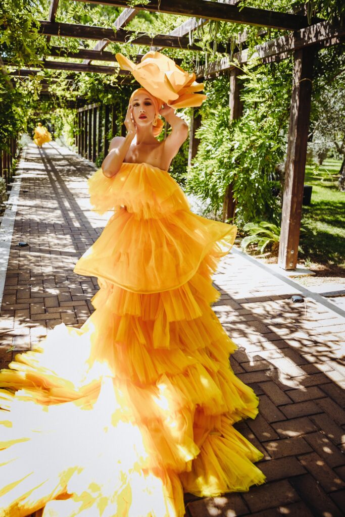 Stunning outdoor event venue by the Adriatic Sea, surrounded by lush greenery and lemon-themed decorations.