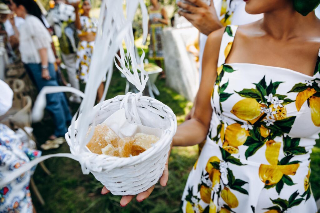 Stunning outdoor event venue by the Adriatic Sea, surrounded by lush greenery and lemon-themed decorations.
