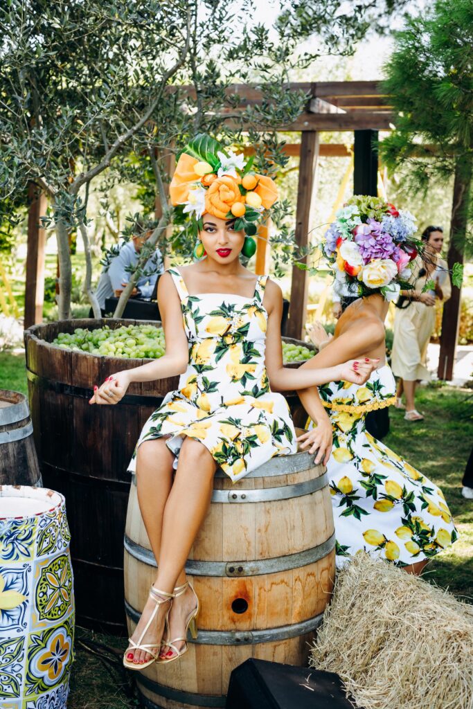 Stunning outdoor event venue by the Adriatic Sea, surrounded by lush greenery and lemon-themed decorations.