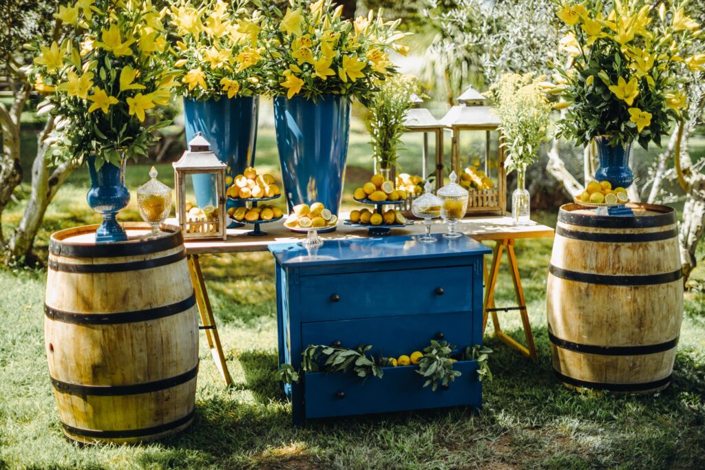 Stunning outdoor event venue by the Adriatic Sea, surrounded by lush greenery and lemon-themed decorations.