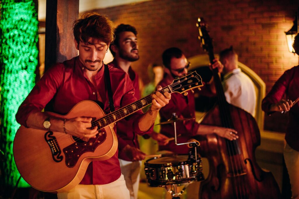 Retro event setup featuring red checkered tablecloths, dim lighting, and vintage decor.