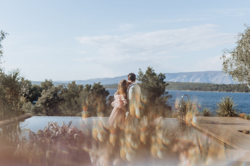 Elegant wedding ceremony setup at Maslina Resort, featuring pastel-colored floral arrangements and the crystal-clear Adriatic waters in the background