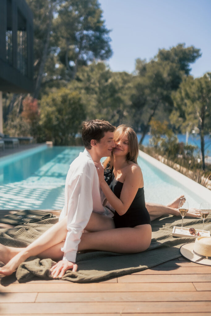 Bride and groom enjoying a quiet, intimate moment by the pool at Maslina Resort, Hvar, with stunning views of the Adriatic Sea.