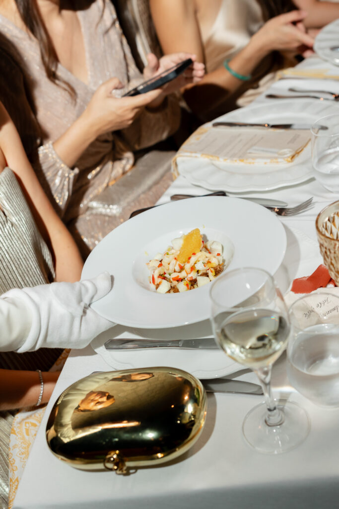 Morgan and Robbie’s three-day Dubrovnik wedding with a Hilton welcome dinner, Banje Beach party, and St. Lawrence Fortress ceremony, featuring signature cocktails, vintage bells, drummers, and a lively French band.