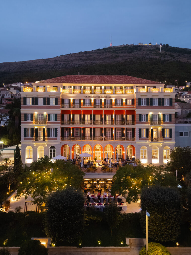 Morgan and Robbie’s three-day Dubrovnik wedding with a Hilton welcome dinner, Banje Beach party, and St. Lawrence Fortress ceremony, featuring signature cocktails, vintage bells, drummers, and a lively French band.