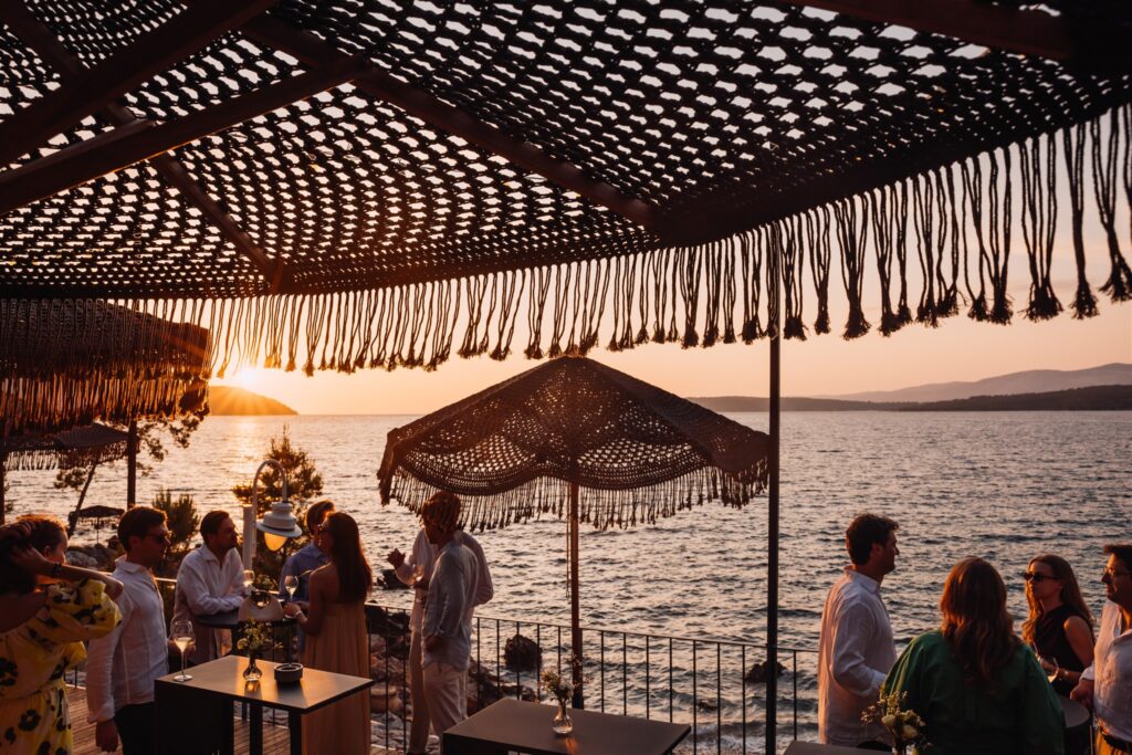 Sunset welcome party at Maslina Resort with cocktails and sea views
