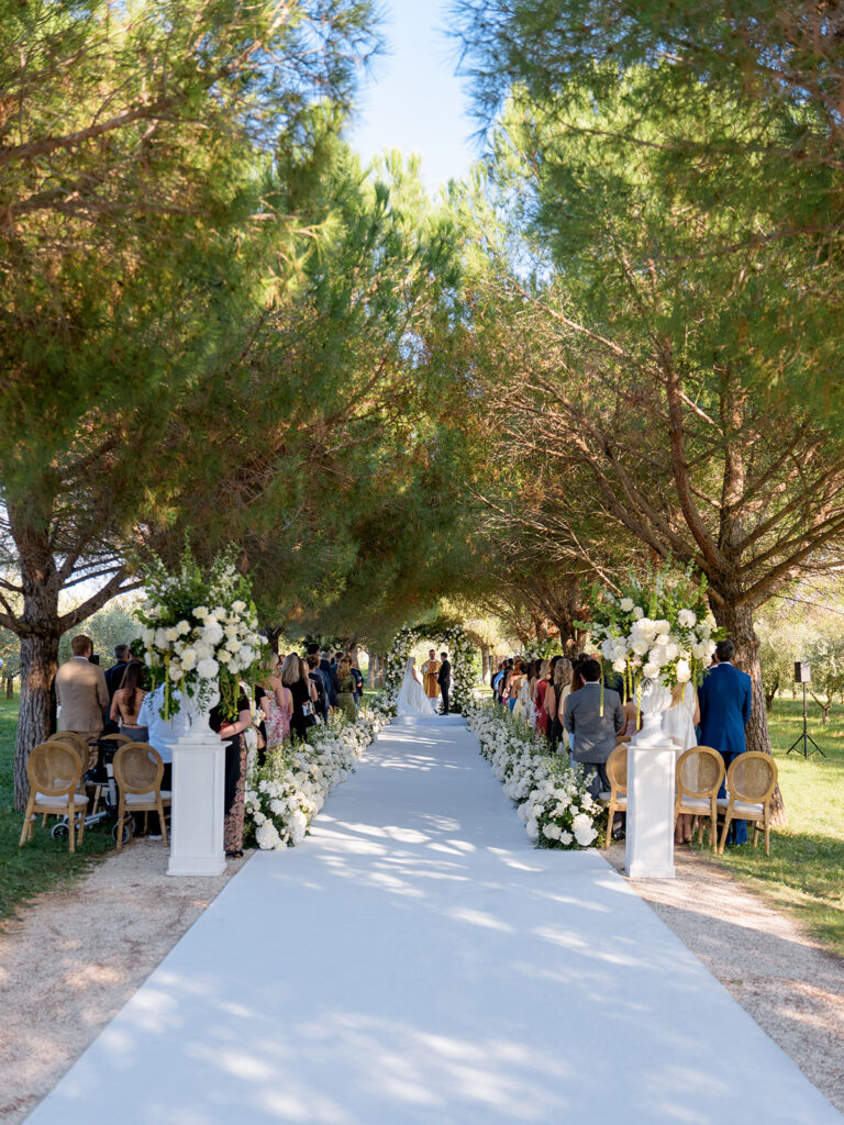 Elegant Meneghetti wedding ceremony surrounded by trees
